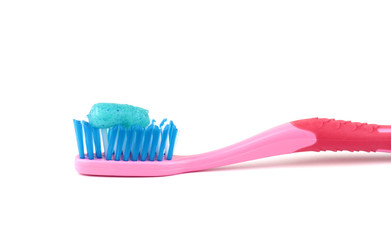  Toothbrush with blue toothpaste on white background.