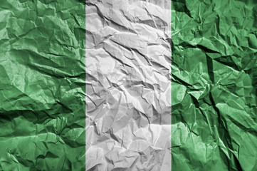 Nigeria flag painted on crumpled paper background