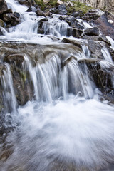 Fototapeta na wymiar freshwater spring flowing in mountain landscape