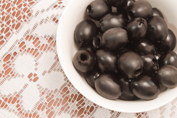 olives on white tablecloth