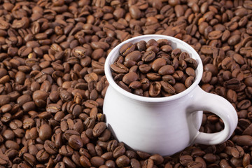 Coffee beans and cup of coffee