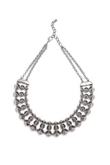 silver necklace with studded on a white background