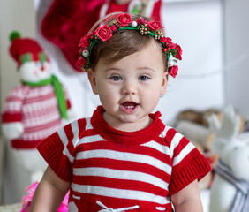 little girl in a beautiful dress and a wreath
