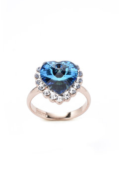 ring with a blue heart on a white background