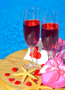 Glasses With Red Champagne  And Starfish