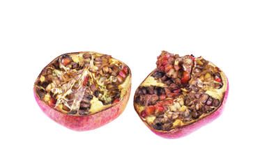 Two rotten pomegranate segments