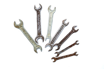set of old wrenches on a white background