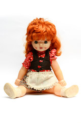 old plastic doll with red hair