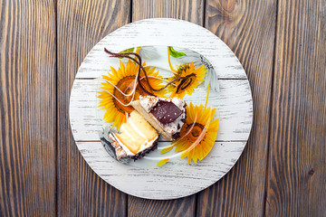 cake with cream on a dark wood background