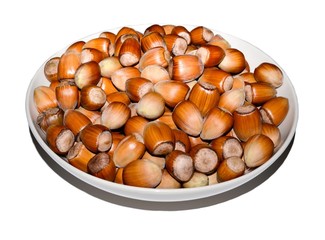 bowl full of hazelnuts isolated on white