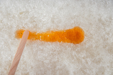 Maple taffy on snow during sugar shack period. In Quebec, Canada