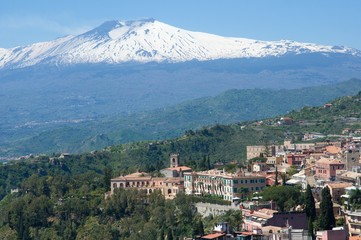 Ancient town Taormina and volcano Etna in the Sicily, Italy