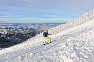 Downhill Skier atop of Kasprowy Wierch in Zakopane in Tatras in winter
