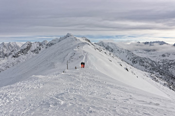 Fototapeta na wymiar People climbing on Kasprowy Wierch in Zakopane on Tatras in winter
