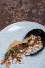 Julienne with mushrooms on a plate