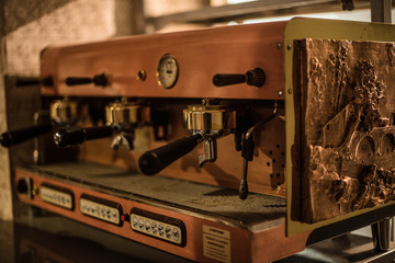 Fototapeta na wymiar Ancient coffee machine is on the table