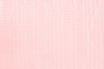 pink linen surface - close up of textile background - pastel ton