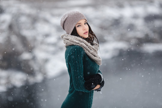 Beautiful young woman in wintertime outdoor