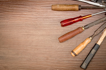 different old tools on wood