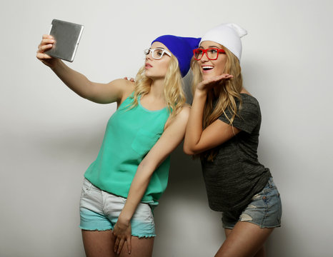 two hipster girls friends taking selfie