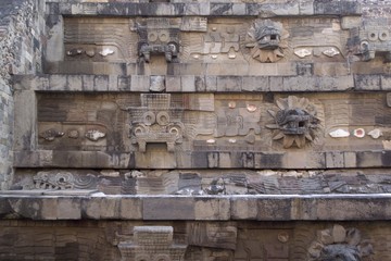 Close up depiction of Aztec gods on an ancient pyramid