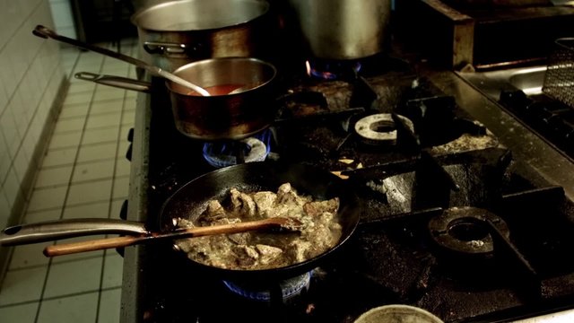 cooking meat in pan
