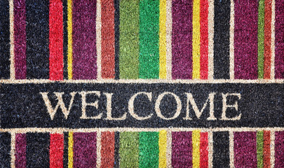 Doorway rug or doormat, welcome, natural fibers, background, toned image