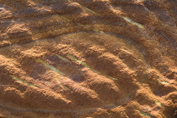 Patterned sandstone texture background.
