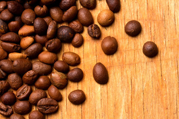 Coffee beans on wood background