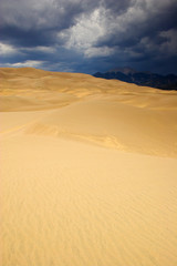 Fototapeta na wymiar Thunderstorm over sand dunes