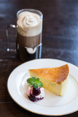 Piece of blueberry cheesecake and coffee latte