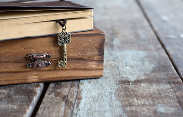 vintage key heart shape and old notebook on Wood box grungy old