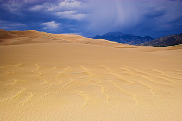 Thunderstorm over sand dunes