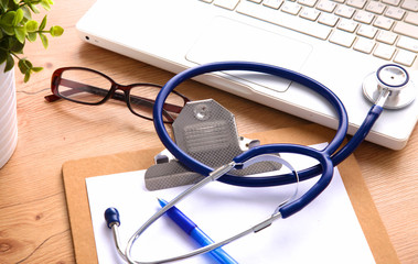 Stethoscope on laptop keyboard. Concept 3D image
