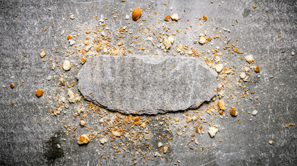 Bread crumbs and a stone stand.  Free space for text .