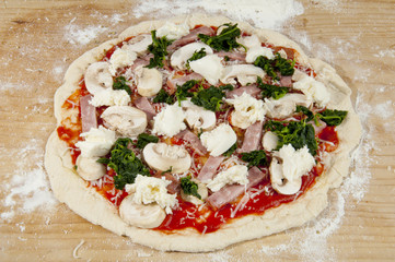 Whole homemade pizza, raw, unbaked