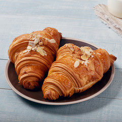 Fresh homemade croissants with almond chips