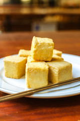 fish Tofu in the plate on a wooden table