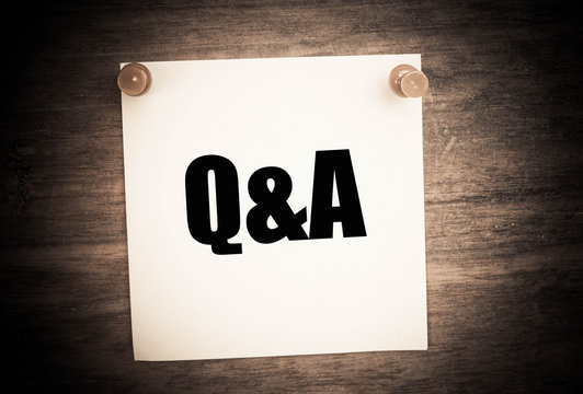 Q&A or Questions and answers concept on note paper 