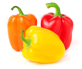 colored peppers over white background