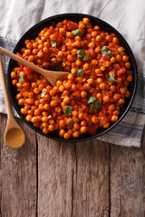 Indian Food: chickpeas in curry sauce. Vertical top view
