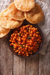 Delicious Indian Chana masala and puri. Vertical top view
