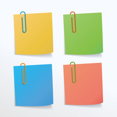 Different colors of paper clips and paper notes