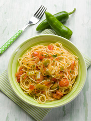 spaghetti with green hot chili pepper and fresh tomatoes