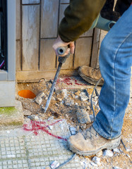Construction site - worker using Jackhammer..Selective focus and motion blur