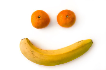 Smile from fruits mandarins and banana