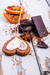 cake, chocolate and star anise on shabby wooden background