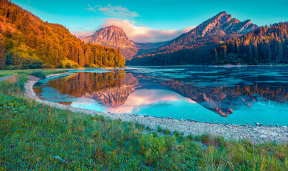 Colorful summer sunrise on the incredibly beautiful Swiss lake O
