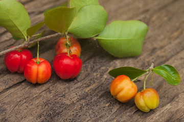 Cherry fruit on the wooden background.