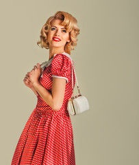 charming blonde pin-up girl with little bag